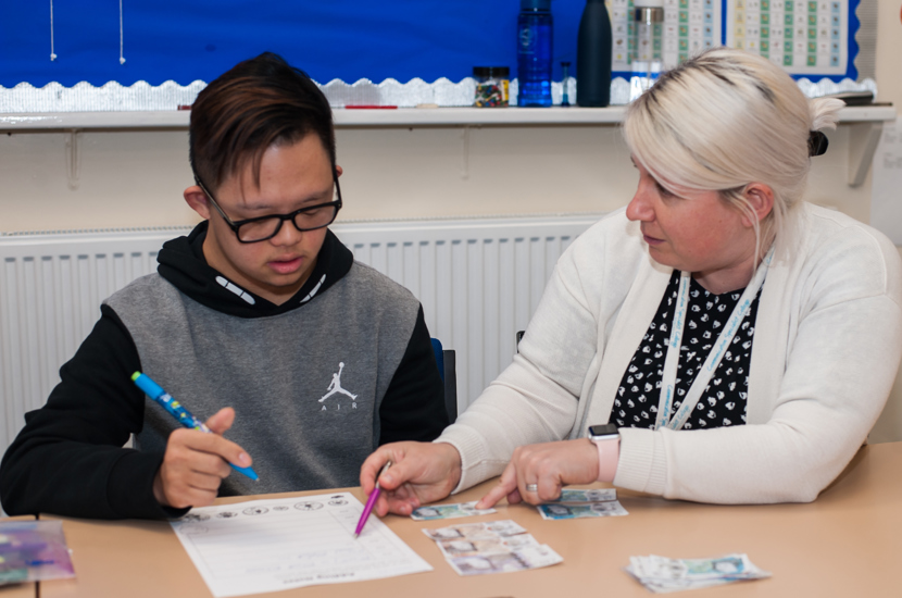 Student working with staff 