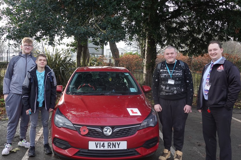 (from left to right) Students Alfie Davies, Andrii Chyzh and Jack Grice with driving instructor, James Varney.