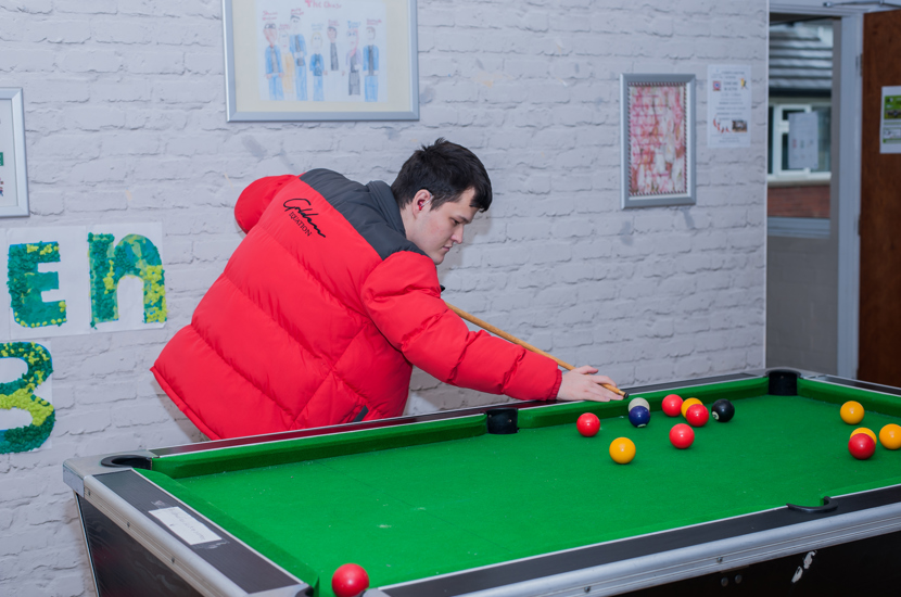 student playing pool