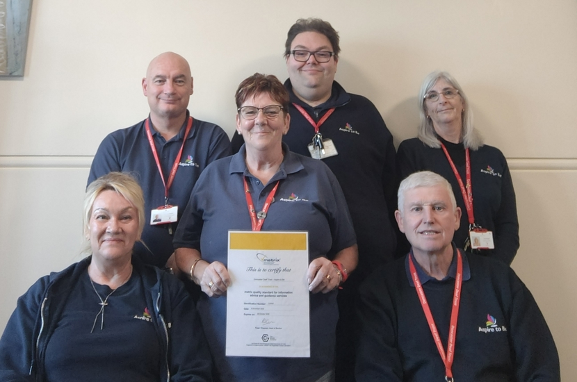 Aspire to Be team showcasing their Matrix Standard certificate