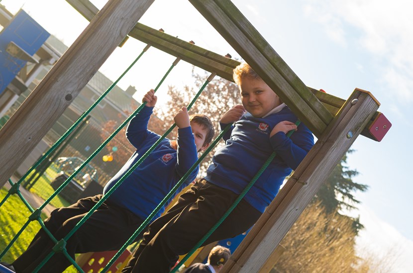 Doncaster School for the Deaf pupils on outdoor play equipment