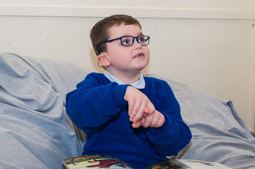 Doncaster School for the Deaf pupil with a book